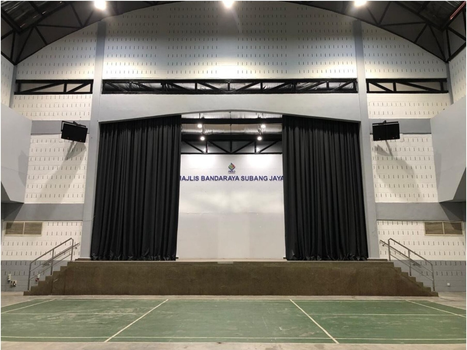 Wide black stage curtains in Subang Jaya sports and events hall