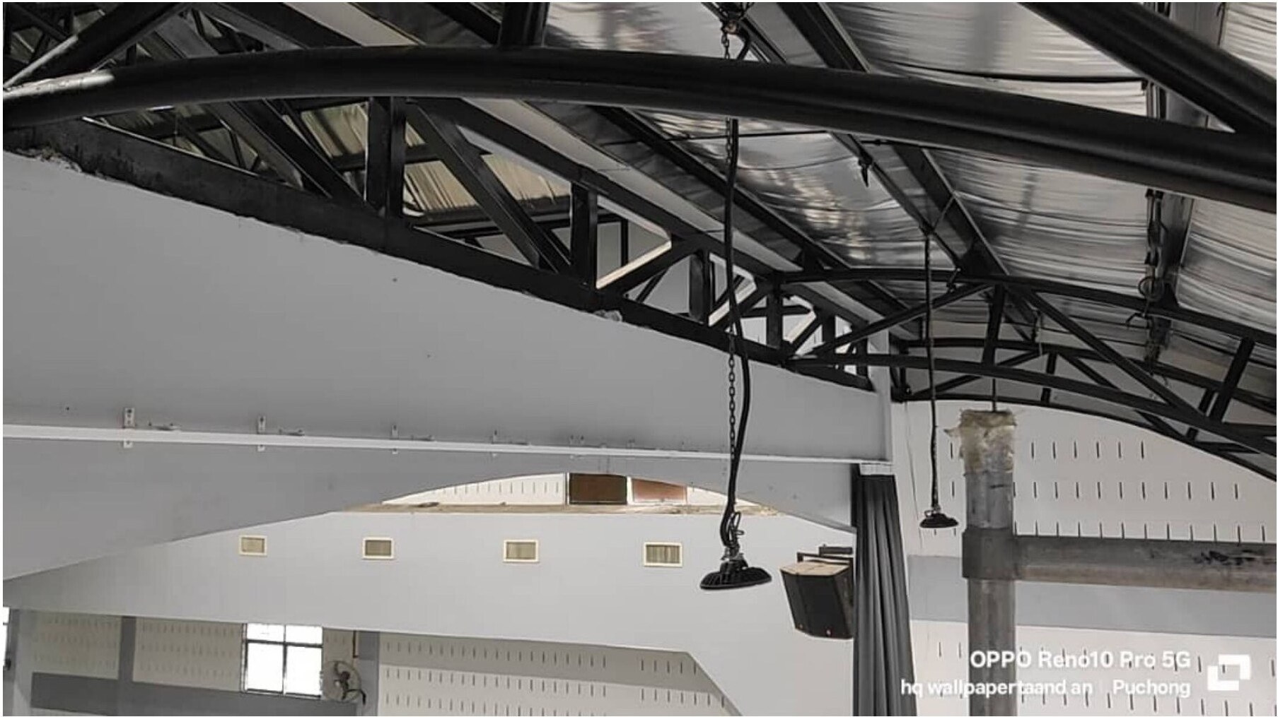 Industrial hall interior showing curtain installation site