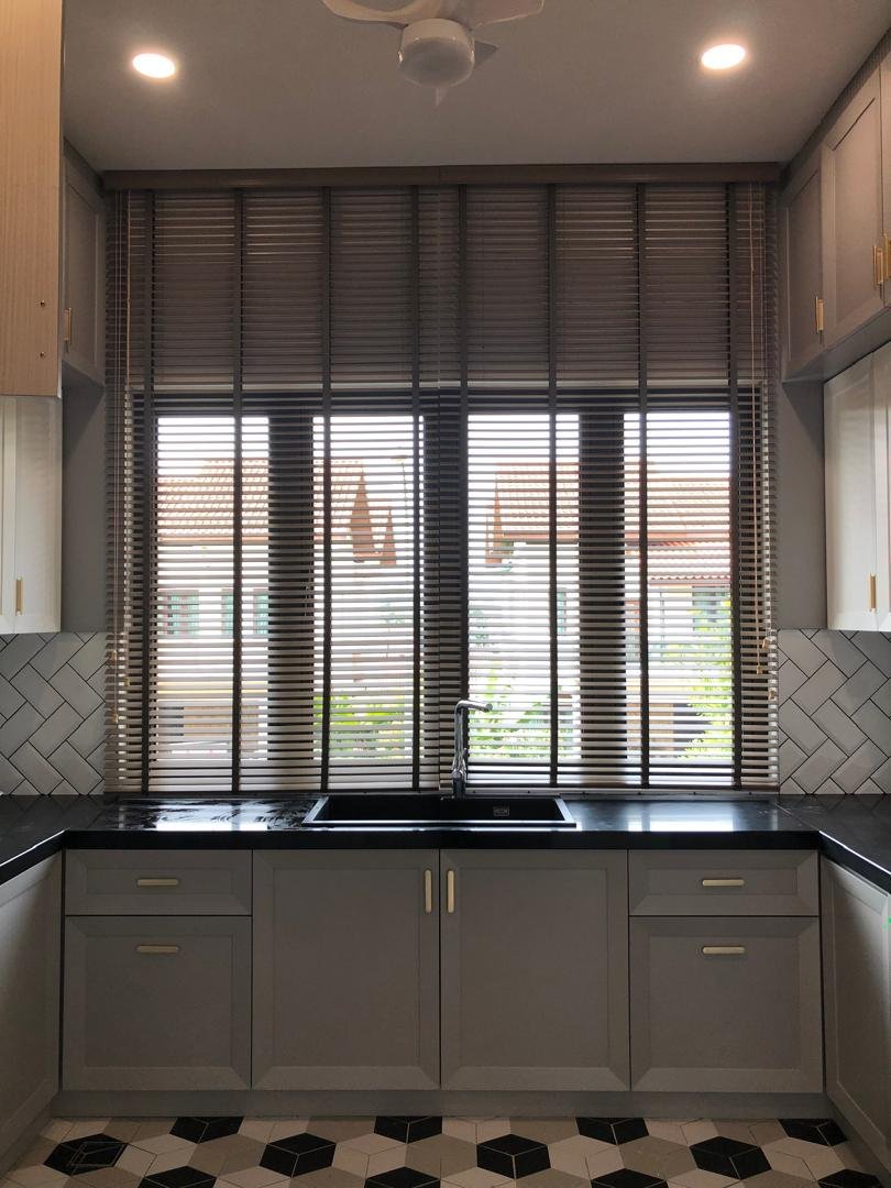 Dark venetian blinds in a Malaysian kitchen with herringbone backsplash